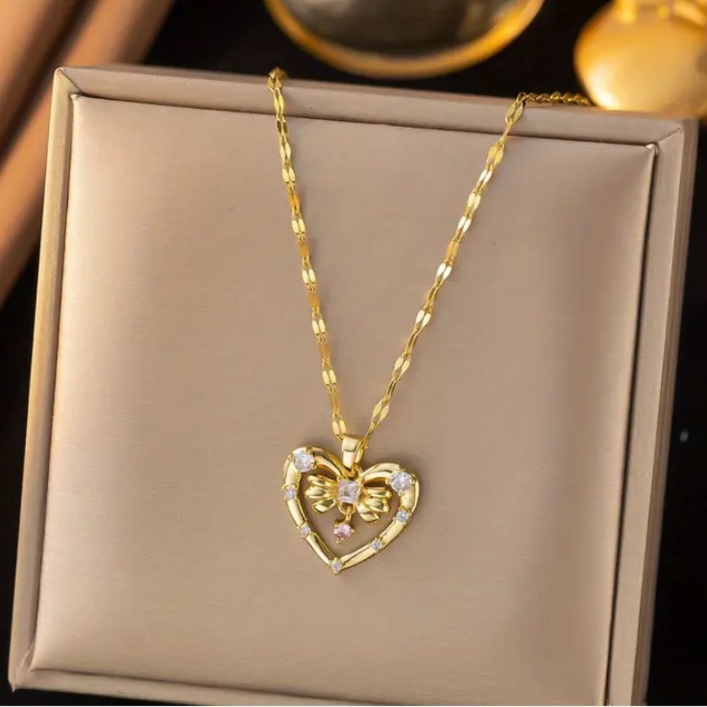Gold Tone Heart Pendant Necklace with Intricate Openwork Design